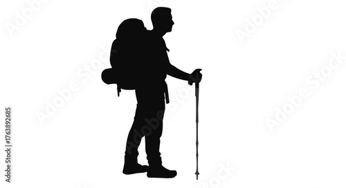 Silhouette of a hiker with backpack and trekking pole