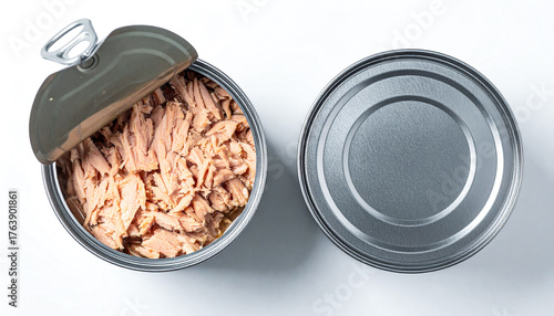 Two tuna cans top view one opened one sealed