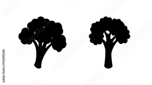 Two simple black silhouette broccoli stalks isolated on white representing fresh healthy food