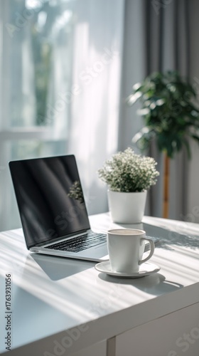 Cozy Workspace Setup With Laptop, Coffee Cup, and Indoor Plant in Natural Light