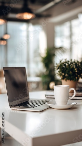 Working at a Cozy Cafe With a Laptop and Cup of Coffee on a Sunny Afternoon