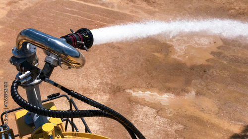 Schilderij op canvas View of a fire monitor with a water sprinkler installed on a mining water tanker