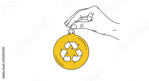Recycling symbol on christmas ornament held by hand in minimalist design
