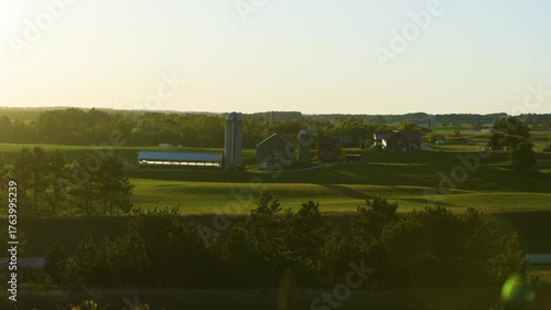 Wide Shot Farmland near highway during sunset