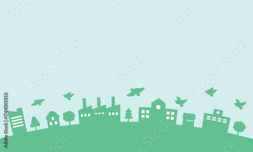 シルエットの街並みと鳥