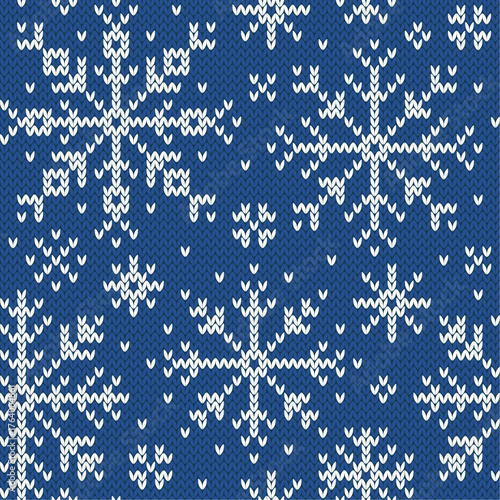 Snowflakes jacquard seamless pattern. Blue and white knitted background. Northern winter style. Vector illustration.