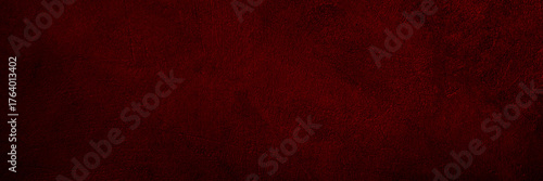 Black dark red texture background. Painted concrete wall surface. Grunge rough uneven plaster scratched damaged. Close-up. Design.Template. Empty blank. Wide banner. Panorama.
