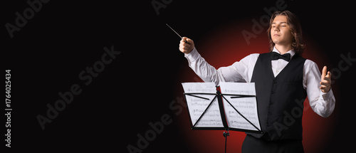 Male conductor with note sh...