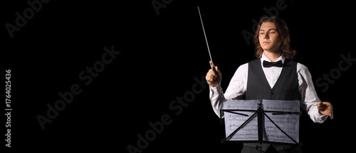 Male conductor with note sh...