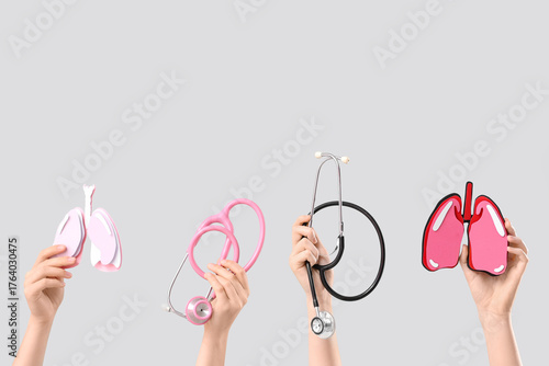 Hands holding lung models a...
