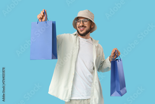 Stylish young man with shop...
