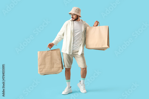 Stylish young man with shop...