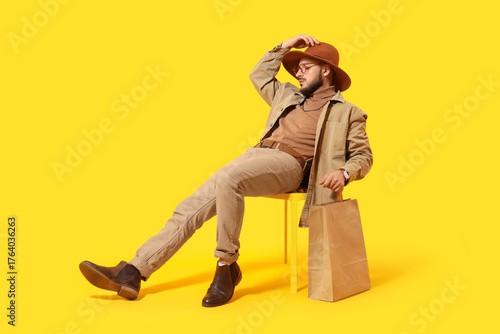 Stylish young man with shop...