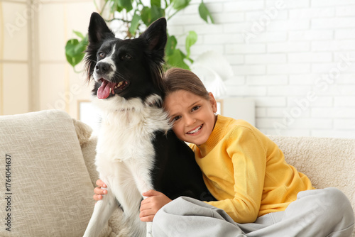 Cute little girl hugging Bo...