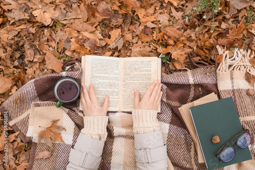 Female hands with book and ...