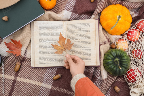 Female hand with autumn lea...