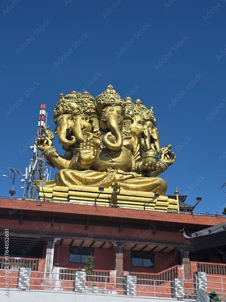 Obraz premium Beautiful Lord Ganesh statue standing in a very peaceful surrounding.