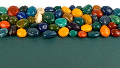 Colorful stones border on dark backdrop