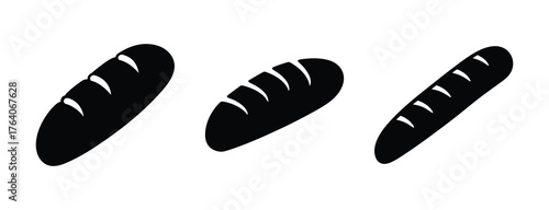Three dark baguettes on white with scoring lines bakery food freshly baked bread artisan french loaves