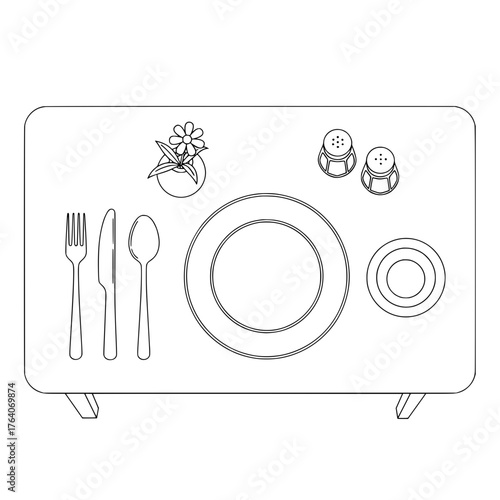 Overhead view of a table setting with plate cutlery and salt and pepper shakers.