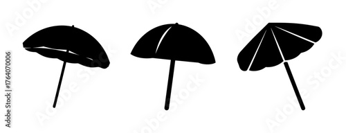 Three black beach umbrellas silhouette isolated on for summer vacation fun