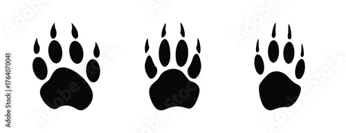 Three realistic black bear paw prints side by side showing detailed texture and five toes