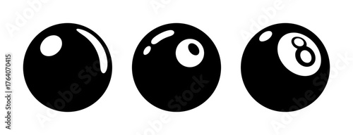 Three black billiard balls one with the number 8 symbol showing reflections and glossy surface