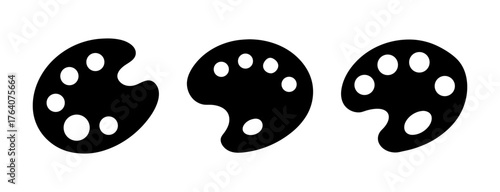 Set of three black artist paint palettes with circular wells for mixing colors abstract design