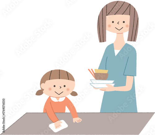 食後の片付けをする親子