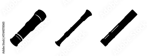 Three distinct black bamboo flutes in different styles representing musical tradition and wind instruments