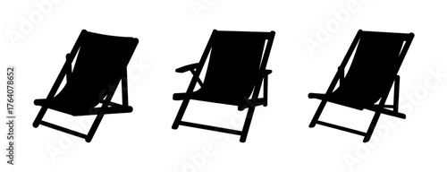 Collection of three black silhouette beach chairs arranged side by side on a