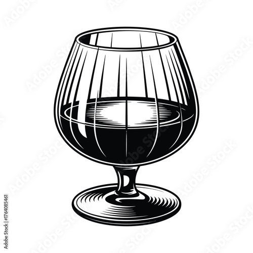Vintage brandy snifter glass filled with dark liquid
