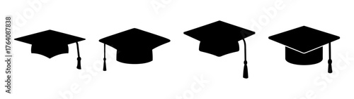 Four graduation caps with tassels symbolizing academic achievement and graduation ceremony celebrations