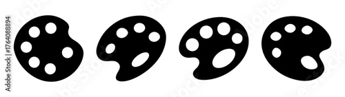 Four black art palettes with multiple circular paint wells arranged horizontally