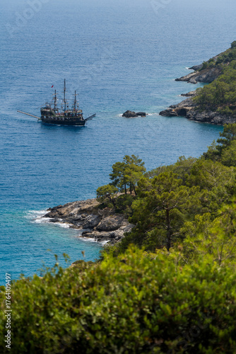 pirate ship next to island coast