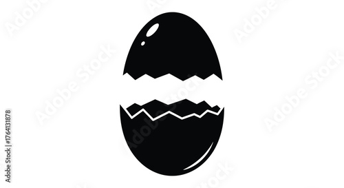 A cracked open egg with jagged edges revealing the inside in a stark black silhouette against a white background symbolizing new beginnings or breaking free silhouette