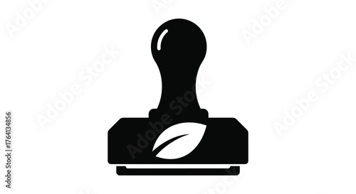 A black silhouette of a coffee tamper with a stylized leaf or bean symbol on its base