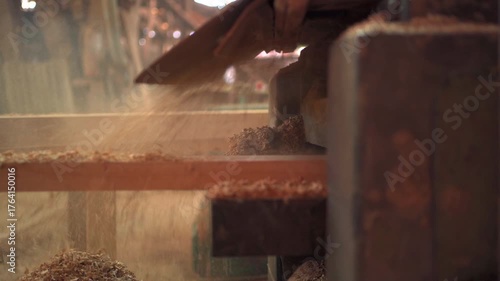 Close up woodworking machine cutting timber log