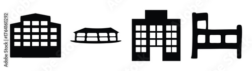 Set of four simple black silhouette icons representing buildings and a bed for hospitality and lodging concepts