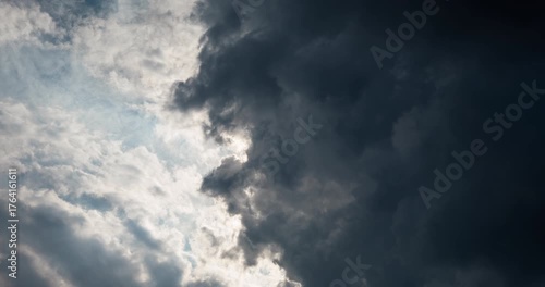 Wallpaper Mural Timelapse of sun rays passing through thick dark clouds Torontodigital.ca