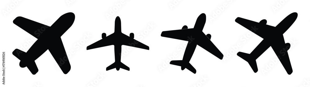 Obraz premium Set of four black airplane silhouettes with slightly textured appearances displaying different orientations and angles