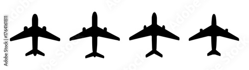 Four silhouetted airplanes in a row aircraft transportation travel aviation journey