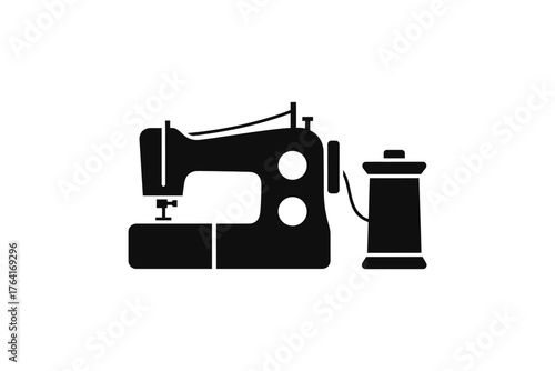 Sewing machine and thread spool isolated on white background, a symbol of tailoring, fashion, and textile industry work