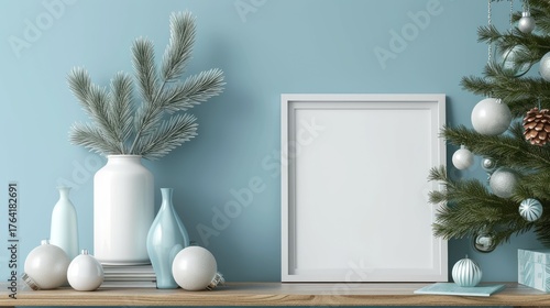 Stylish winter scene featuring a blank frame, ornaments, and decorative vases on a wooden shelf against a blue wall.