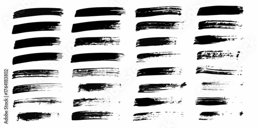 Collection of black ink brush strokes and smears on white background abstract art elements