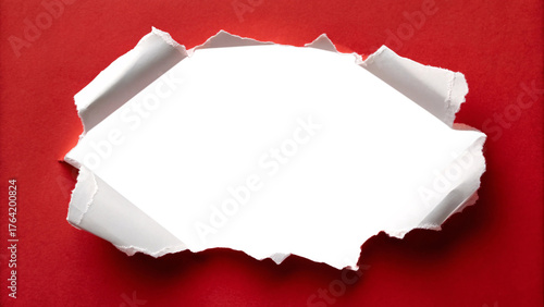 White torn paper hole revealing blank space through red background with rough jagged edges and curled fragments