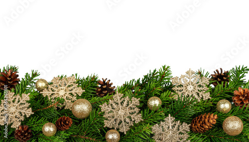 Gold and red Christmas balls, fir branches, and pine cones create a festive holiday decoration on a white background for a new year celebration.