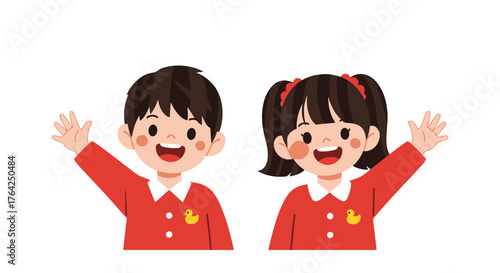 Two cheerful children waving hands wearing red uniforms smiling happily.
