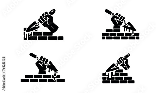 Construction bricklaying icon showing worker hand with trowel building wall concept in black silhouette
