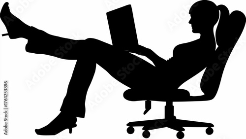 Silhouette of woman reclining in office chair with laptop and heels with legs up on desk relax